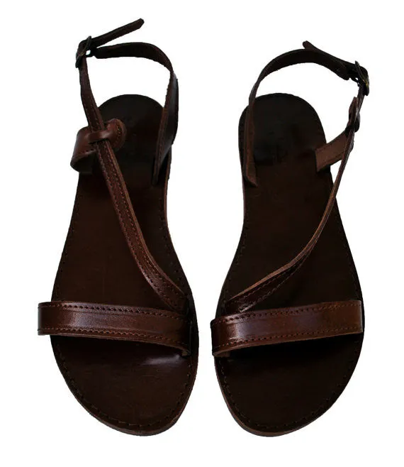 Dark brown leather sole Niki fashion sandals with wide front strap.